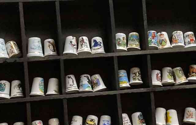 A collection of thimbles on a shelf Kosice - photo 3